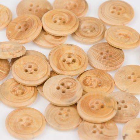Bouton bois à trous