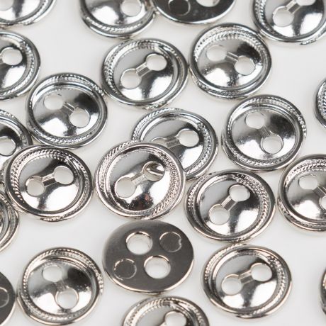 Bouton m�tal � trous