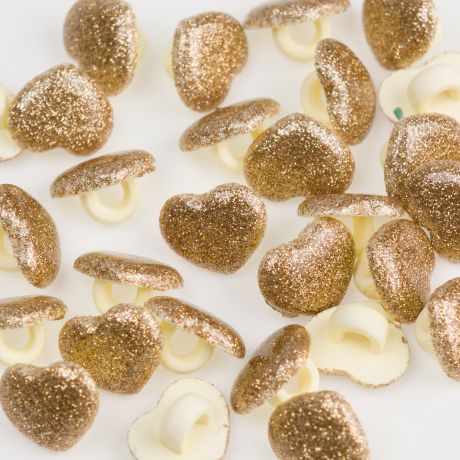 Bouton coeur dor� � queue